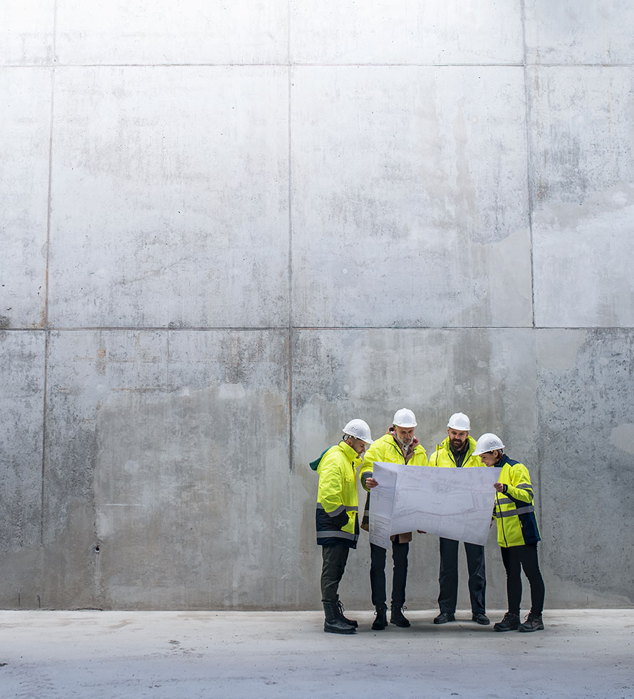 group of executives looking at floor plan