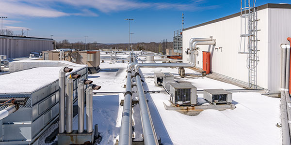 commercial roof covered in snow