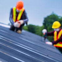 roofers are installing metal roof